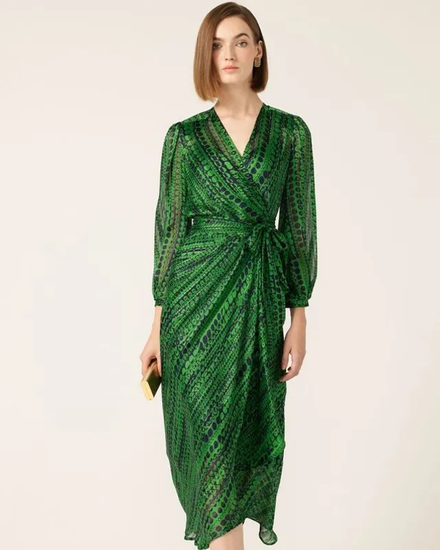 Model in a green satin wrap dress